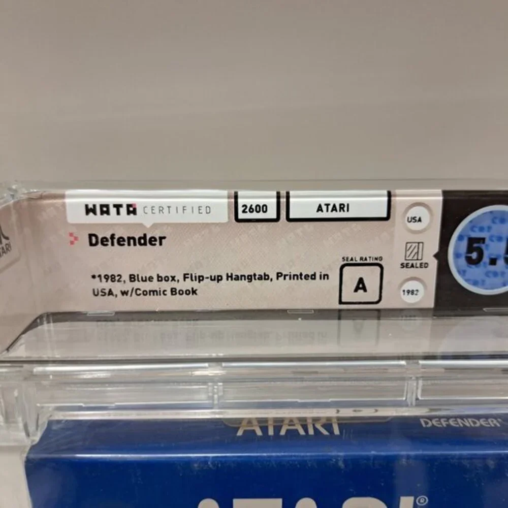 Atari 2600 DEFENDER - EARLY HANGTAB BLUE BOX! WATA GRADED 5.5! NEW & UNOPENED!